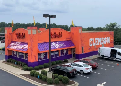 Exterior paint and wall and window art themed for Clemson sports team.