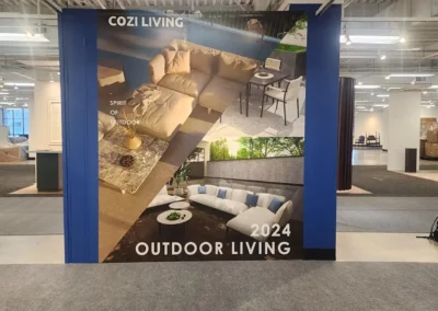 Office wall mural with text that reads "Cozy Living" where cozy is spelt with an "i" instead of "y". Two images of outdoor patio furniture are presented with text that also reads "Spirit of outdoor".