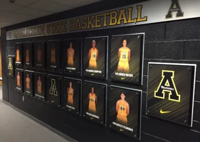 Wall-mounted images of Appalachian State basketball players